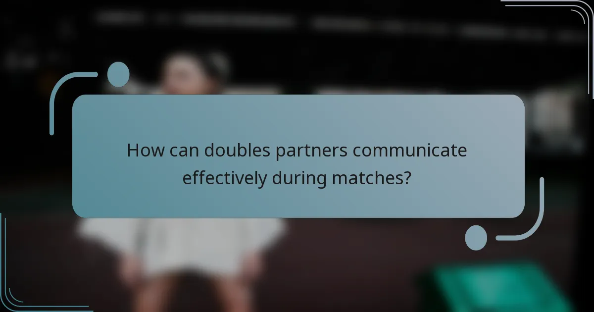 How can doubles partners communicate effectively during matches?